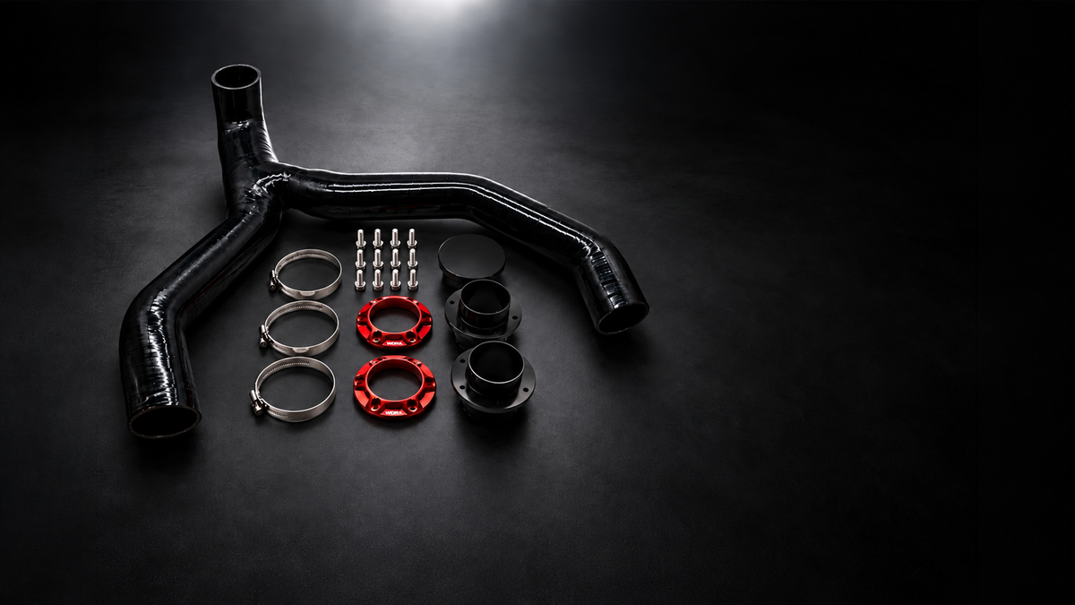 Contents of the WORX Sea-Doo Spark dual rear exit exhaust kit: dual silicone hose, three hose clamps, two anodised outlet rings, two bulkheads, block off plate and twelve bolts