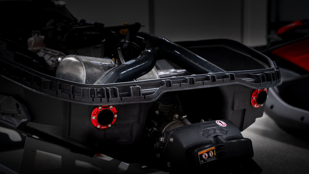 Seadoo Spark hull with the WORX dual rear exit exhaust fitted, showing both Race Red outlets